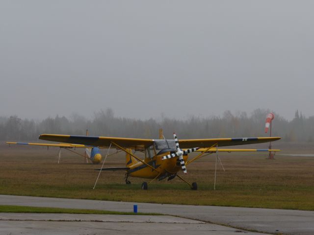 — — - Royal Canadian Air Cadets glider tow plane, at Russ Beech air field. Gliders in background.