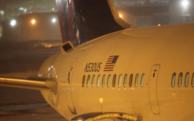 Boeing 757-200 (N530US) - Tail section of N530US during a Monday night snow storm on 02/22/2011