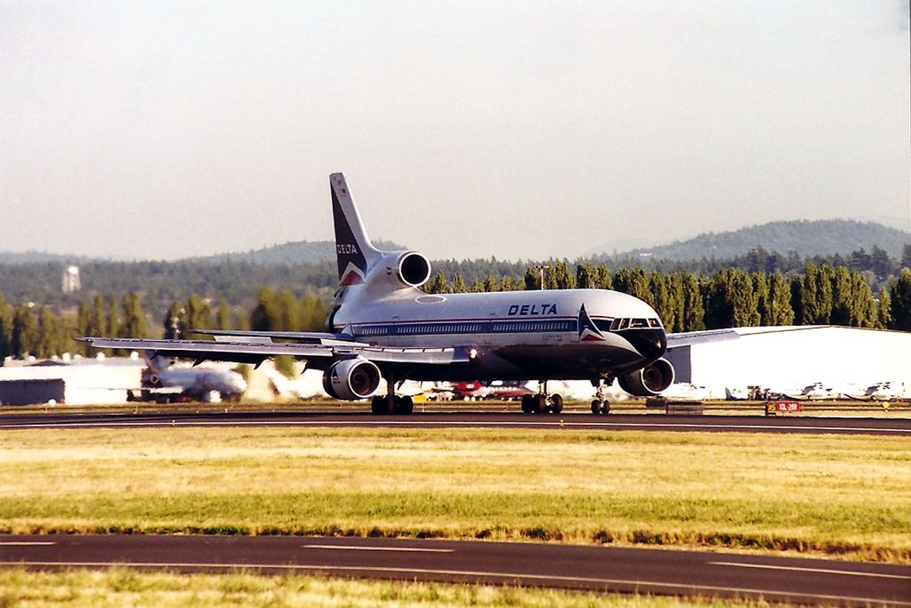 Lockheed L-1011 TriStar (N739DA) - KPDX - N739DA braking down after a long haul from ATL this jet arriving late PM in the Pacific Northwest in late summer possibly August 1989