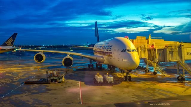 Airbus A380-800 (9V-SKS) - Singapore Airlines A380 parked at a Changi gate in blue hour, prior to flying to Frankfurt a few hours later