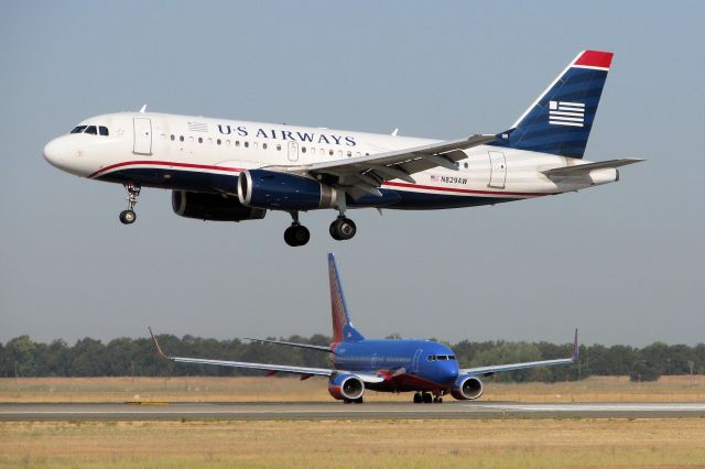 Airbus A319 (N829AW) - Over the keys on very short final to Sacramentos runway 16L.