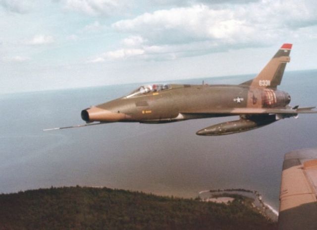 — — - F-100D in formation- early 70s, 178th TFG. 335 gal drop tanks.