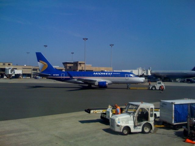 Embraer 170/175 (RPA2016) - New Embraer 170 repainted in Midwest colors being towed to the gate.