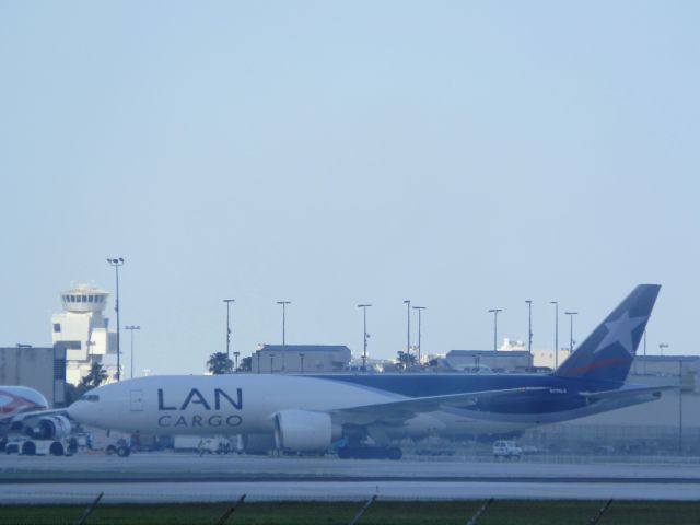 BOEING 777-200LR (N778LA) - Pushback "In the haze!"