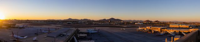 Airbus A320 (N661AW) - Panorama of sunset at PHX on 7/7/22. Taken with a Canon 850D and Sigma 18-35mm Art Lens.