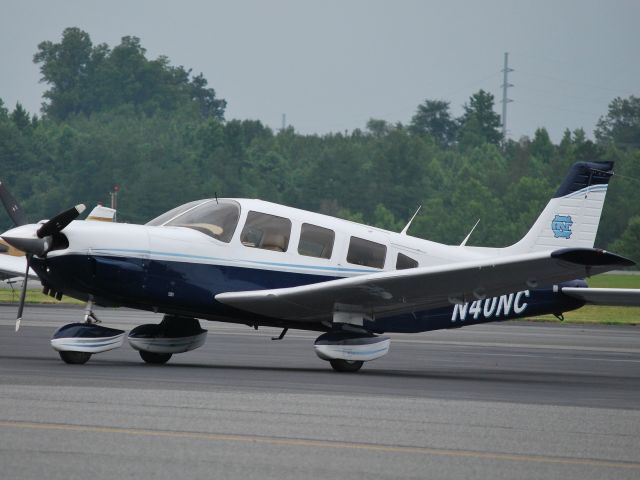 Piper Saratoga/Lance (N40NC) - Parked on the ramp at Concord Regional Airport - 6/17/09