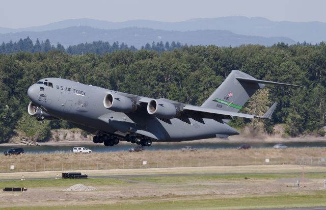 Boeing Globemaster III (02-1108) - C-17A Departing PDX with vice president Joe Bidens vehicles.