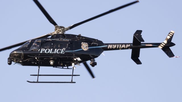 Bell 407 (N911AP) - N911AP approaching the PGPD hangar at College Park Airport 
