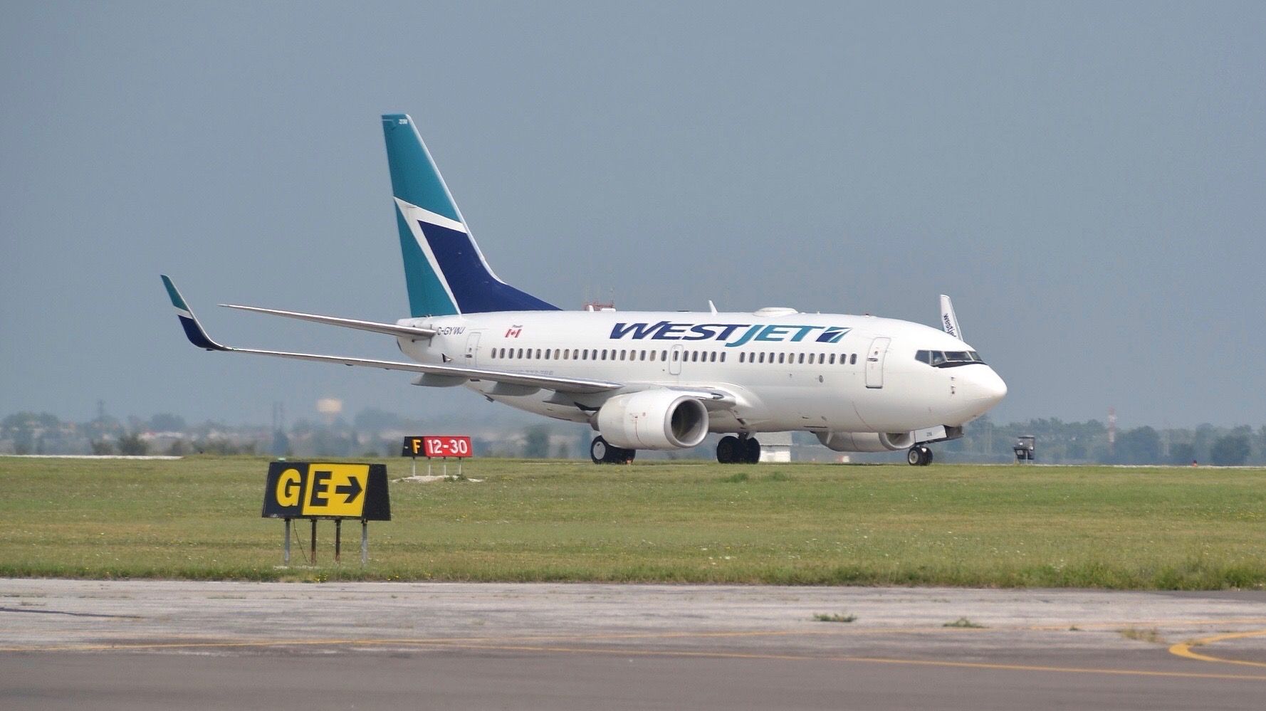 Boeing 737-700 (C-GYWJ) - A West Jet Boeing 737-700 taxing at "Windsor International Airport". It was coming from Calgary.