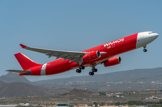 Airbus A330-300 (EC-NTY) - Wamos Air has acquired this plane from Air Asia, and has kept the colors of the fuselage of the Asian company, putting the titles of wamos aie in white, a curious combination of the Spanish company.