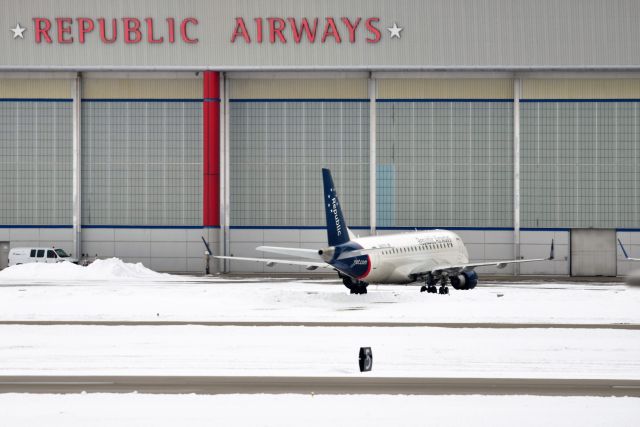 Embraer 175 (N401YX) - Flagship Colors outside hangar on a snow covered ramp 02-17-21