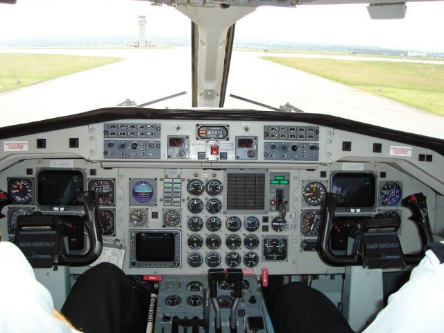 C-GXPS — - Flightdeck of Corporate Express Airlines Saab 340A holding short of runway 16/34 at the Calgary International Airport awaiting a southbound departure on 16 for the flight to Fort McMurray, Alberta, Canada