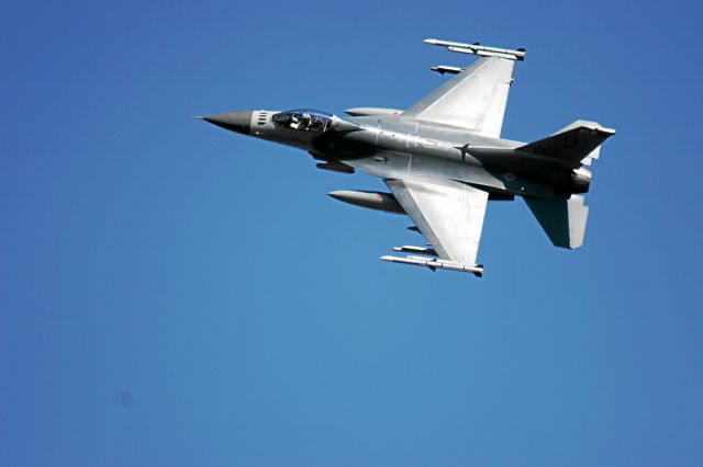 — — - An F-16 from the 148th Fighter Wing Duluth, MN Flies Low Over the Hardwood Range Central Wisconsin in a Show of Force Manuever
