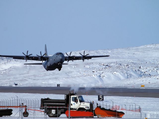 Lockheed C-130 Hercules (N74638) - Departing the Iqaluit airport.