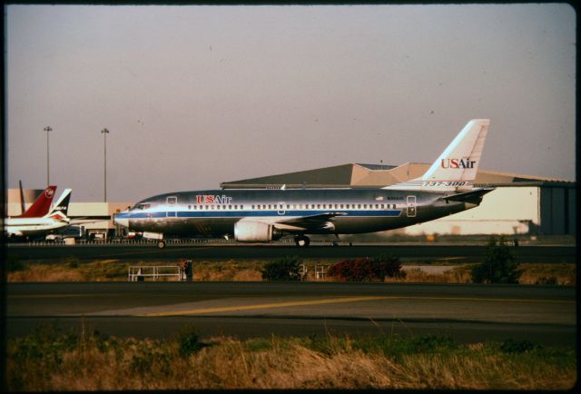 BOEING 737-300 (N351US) - SFO - ex Piedmont 737-300 taxis to the gate at SFO - late PM photo - early to mid 1980s.