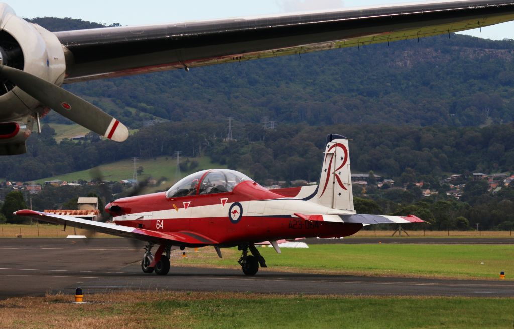 — — - RAAF Roulette No:64 on the return taxiway at Wings over Illawarra Air Show.  Connie in the foreground.