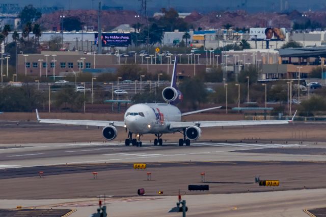 Boeing MD-11 (N606FE) - A FedEx MD11 taking off from PHX on 2/14/23. Taken with a Canon R7 and Canon EF 100-400 II L lens.