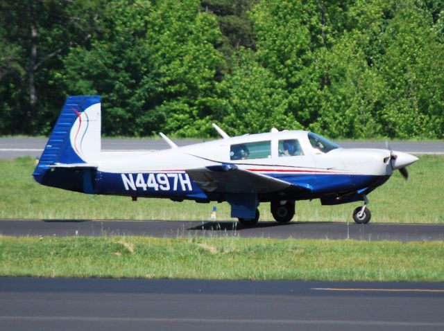 Mooney M-20 (N4497H) - EN ROUTE HOLDINGS INC taxiing to runway 2 at KJQF - 5/26/13