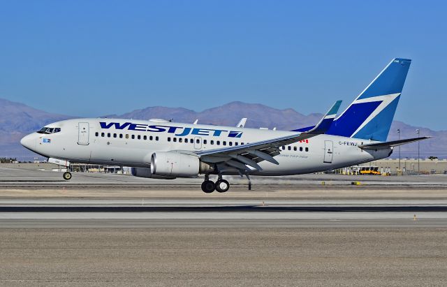 Boeing 737-700 (C-FEWJ) - C-FEWJ WestJet Boeing 737-7CT / 232 (cn 32769/1665) - McCarran International Airport (KLAS)br /Las Vegas, Nevadabr /TDelCorobr /November 3, 2013