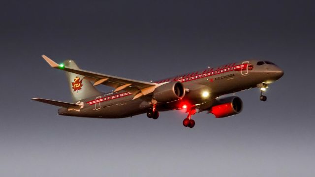 Airbus A220-300 (C-GNBN) - Air Canada's "Trans-Canada Air Lines Livery" coming into Newark's 22L an hour late on a cold October evening.