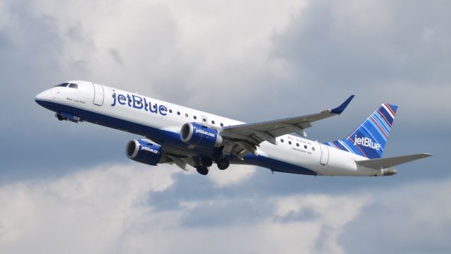 Embraer ERJ-190 (N358JB) - N358JB, "Blues on First" climbing away from Richmonds runway 2. I was visiting Virginia for a week and it rained hard the first three days of the trip, but cleared in the Richmond area on the fourth day and I was able to get some great photos of aircraft I never get to see on the west coast. While it was clear in Richmond, by the time I got back to the hotel which was about 40 minutes south it was pouring rain again. 