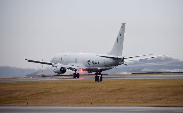 Boeing P-8 Poseidon — - P8 Poseidon after touchdown with vortices still being produced from flaps!