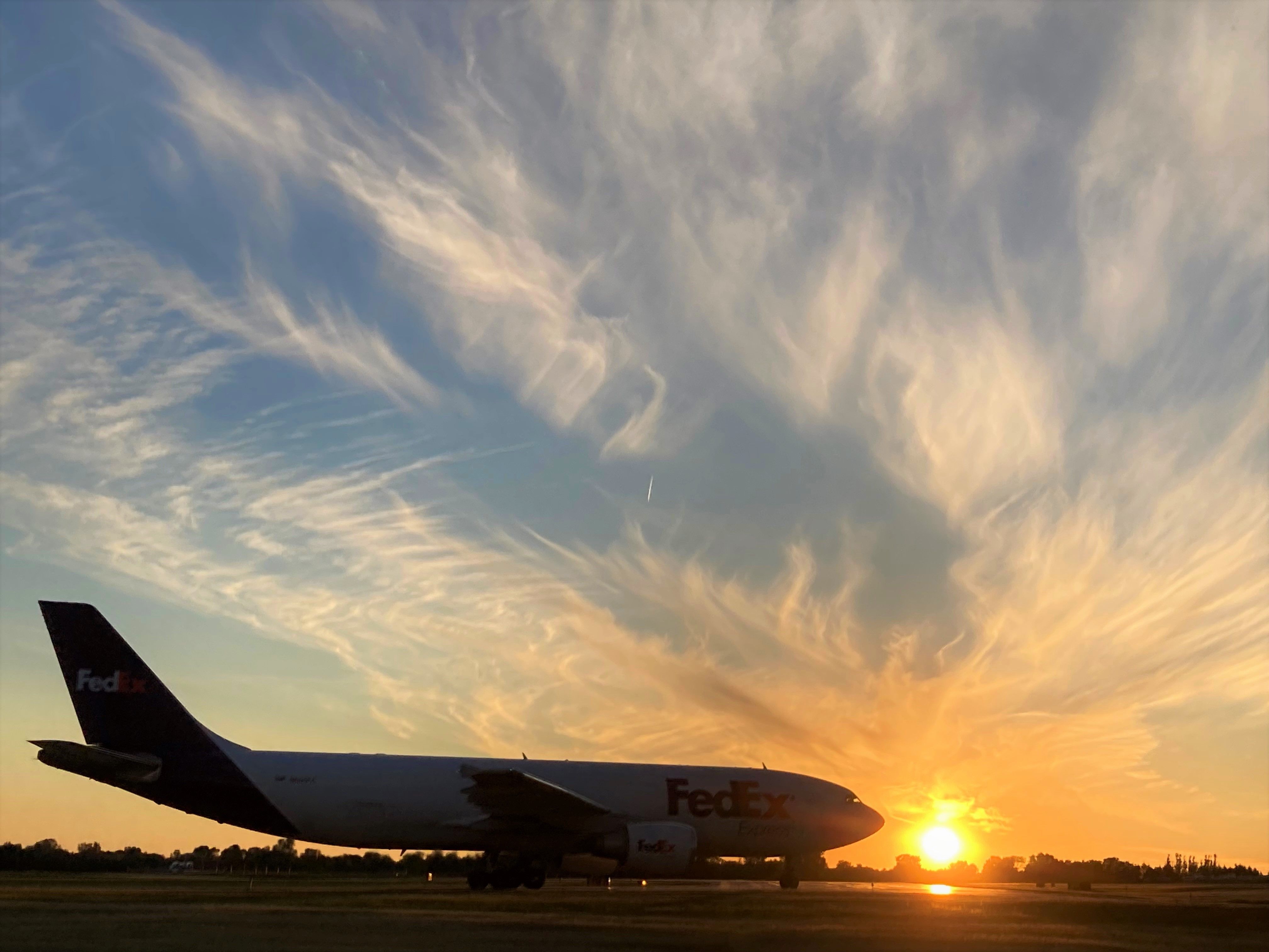 Airbus A300F4-600 (N665FE) - Sky 'O Cirrus.......br /FDX "Ethan" is about to turn on to Runway 21 with a golden sky. 