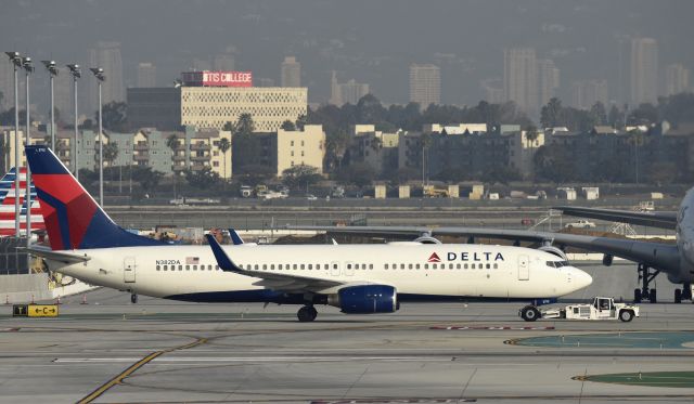 Boeing 737-800 (N382DA) - Getting towed to gate at LAX