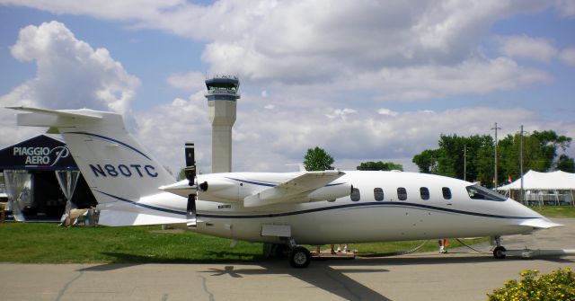 Piaggio P.180 Avanti (N80TC) - N80TC on display in front Piaggio Aero kiosk at Oshkosh 2009.  Completion Center for Piaggio Aero is Denton, Texas (KDTO).  For more info, see Ciao Avanti at:  http://www.planeandpilotmag.com/aircraft/pilot-reports/piaggio-aero/ciao-avanti.html?tmpl=component&print=1&page=