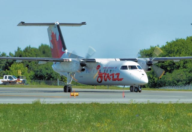 de Havilland Dash 8-100 (C-GOND) - Heading for Montreals Trudeau Airport.