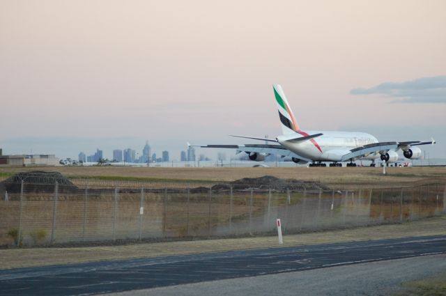 Airbus A380-800 (UNKNOWN) - Was distracted by something else and looked up to see this big bird taxiing in. Melbourne City in the background.