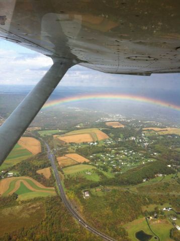 — — - Rainbow to the west of KABE