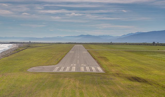 Cessna Skyhawk (ZK-TZR) - Very short finals for a touch and go at Westport (I'm just the passenger!)