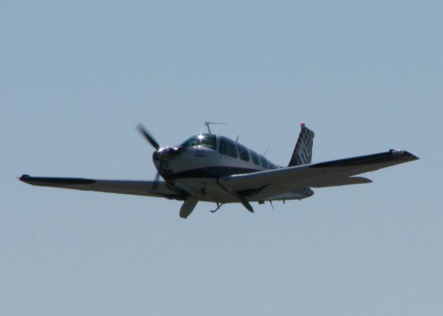 Beechcraft 35 Bonanza (N6066S) - The Greg Poe Air Show crew/support Bonanza departing 32 at the Shreveport Downtown airport. Greg Poes Fagen MX2 took off at the same time with this plane.