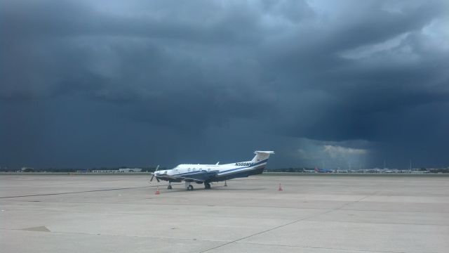 Pilatus PC-12 (N598MM) - N598MM on the ramp at MCO waiting for storms to pass.