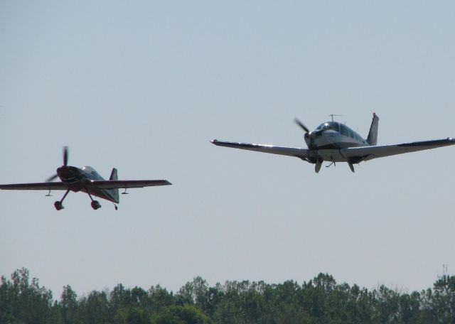 Experimental 100kts-200kts (N71GP) - Greg Poe in his Fagen MX2 off of runway 32 with his crew/support Bonanza (N6066S) at the Shreveport Downtown airport.