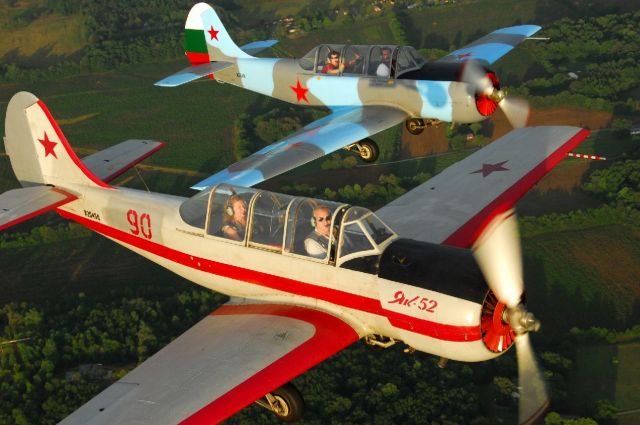 — — - Yak formation flight over Moontown Airport near Huntsville, Alabama. Photo copyright: BlakeMathis.com