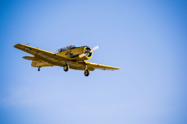 North American T-6 Texan (C-FHWX) - A North American T-6 Harvard (Texan) on final at CYXU.