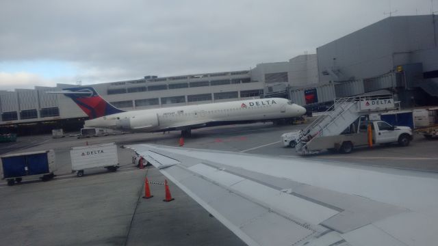 Boeing 717-200 (N975AT) - Seen at gate 40 of the C concourse at SFO. This plane was serving as a delta shuttle with service to LAX. Picture taken from MD-90