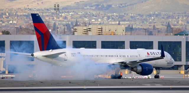 Boeing 757-200 (N694DL) - N694DL, Delta's "The Spirit Of Freedom" special decal bird, has a smoky start here. Perhaps not the most reassuring sight to any first time passengers (lol).  The B752 was about to depart to Atlanta.br /* NOTE:  "The Spirit Of Freedom" decal honors the members of all five military services: Army, Navy, Marines, Air Force, and Coast Guard. *