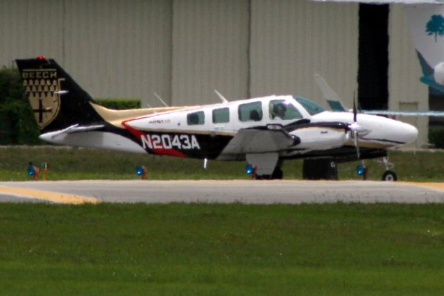 Beechcraft Baron (58) (N2043A) - Lining up to depart rwy 9 on 3-May-18 returning to KTPF.