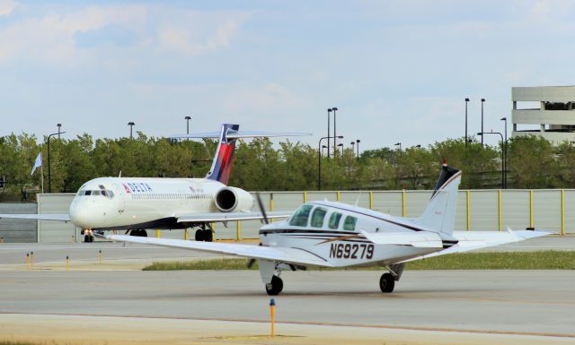 Beechcraft Bonanza (36) (N69279) - Holding short of 22L, Chicago Midway June 2014.