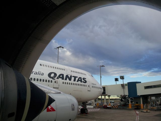 Boeing 747-400 (VH-OJS) - Maintenance inspection during transit. Show the view from number 4 engine looking out.