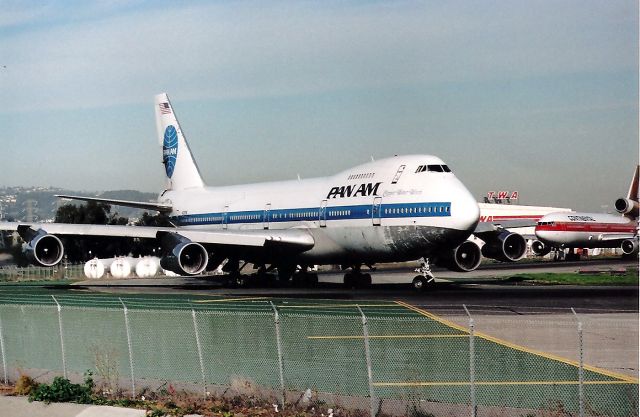 Boeing 747-200 (N728PA) - Clipper Water Witch moves to position and hold at SFO while another classic Continental DC 10 follows Pan Am.
