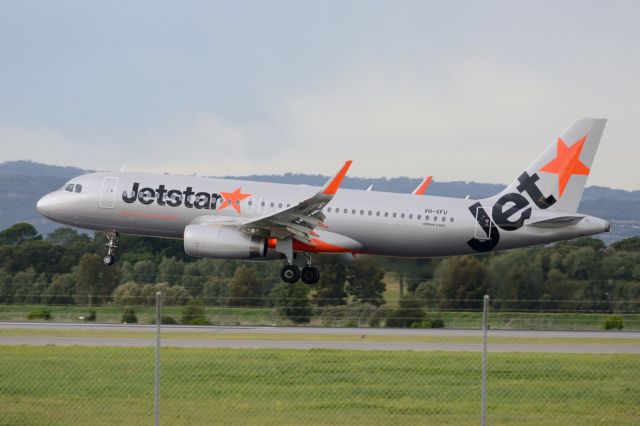 Airbus A320 (VH-VFU) - About to put down on runway 05. Thursday, 19 June 2014.