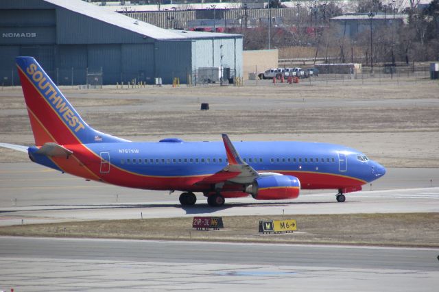 Boeing 737-700 (N767SW) - Southwest 737-700 turning onto 21R at Detroit. Photo taken 4/4/2015.