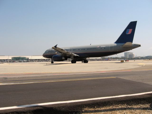 Airbus A320 (N416UA) - Holding short of RWY 19R