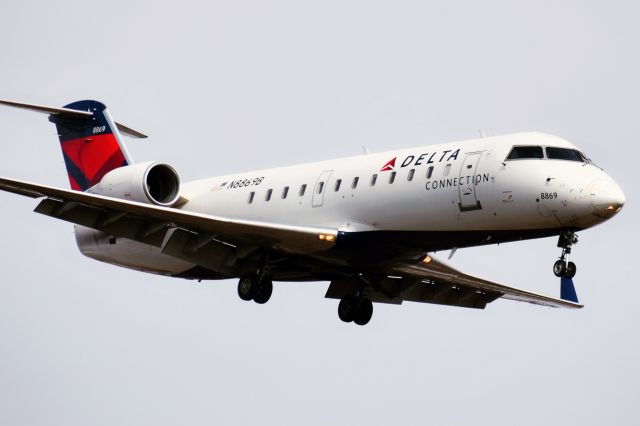 Canadair Regional Jet CRJ-200 (N8869B) - N8869B on short final for Runway 23 at the Buffalo Niagara International Airport from NYC (JFK) as DL4709