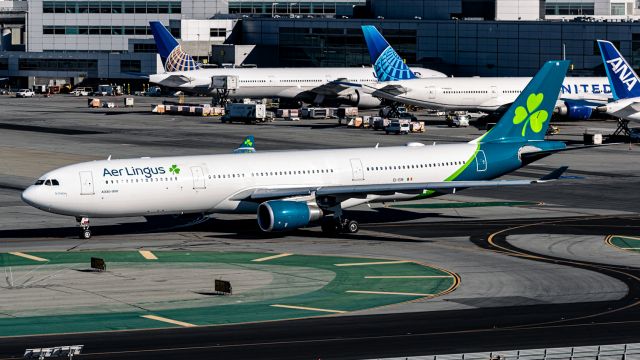 Airbus A330-300 (EI-EIN) - Shamrock A330 in the new colors taxiing past the G gates at KSFO.