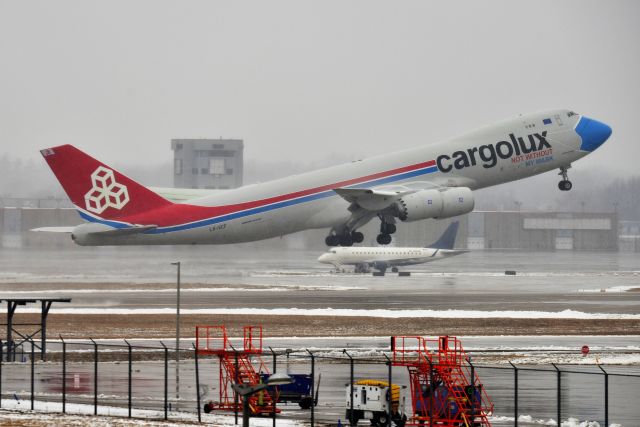 BOEING 747-8 (LX-VCF) - Not without my mask departing 5-L on a very rainy, dreary, sloppy weather day. 01-31-21